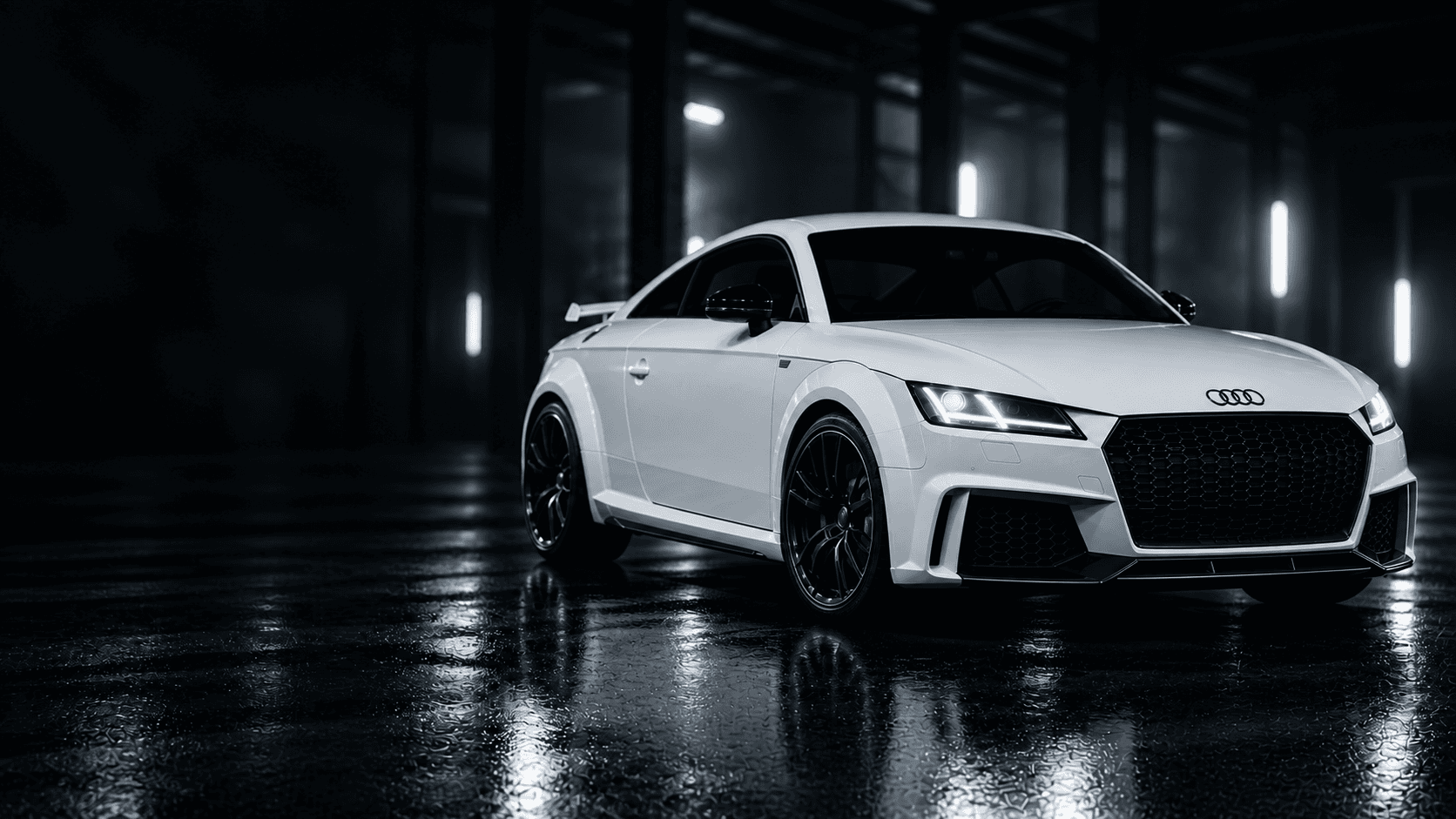 Audi alb într-un garaj întunecat